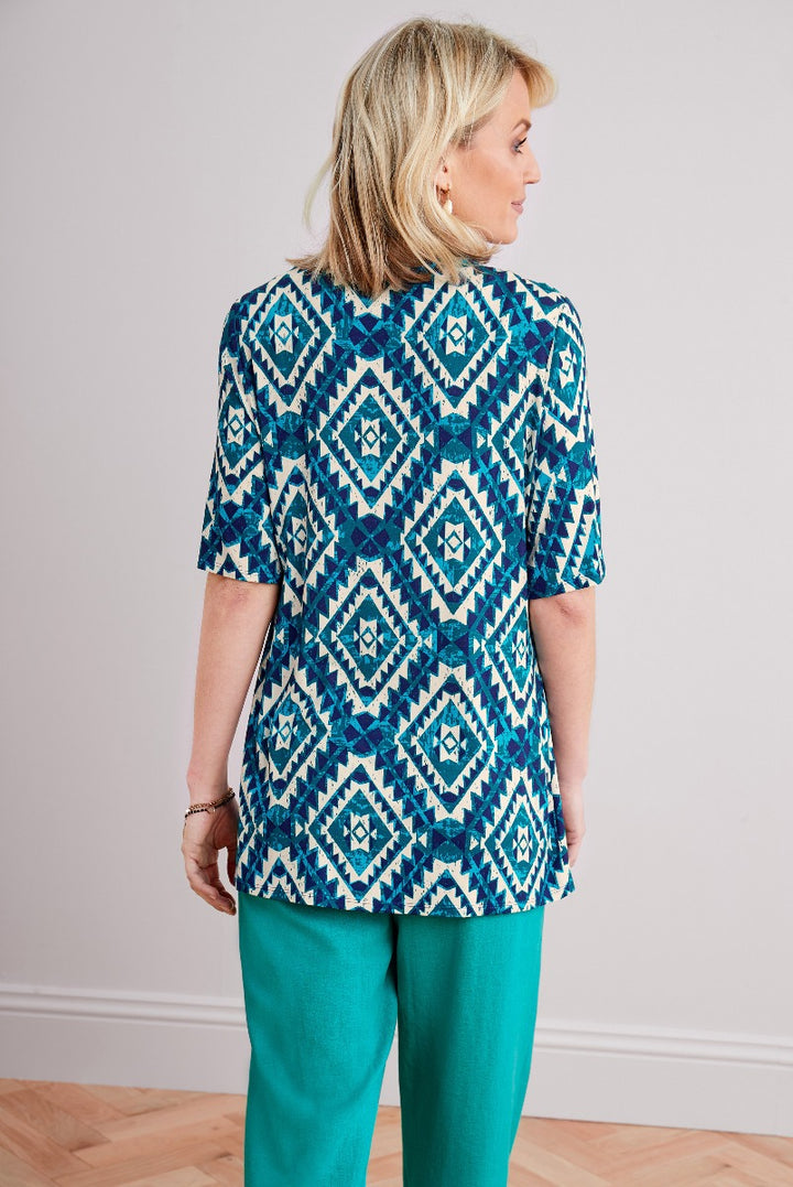 Lily Ella Collection geometric print top in blue and teal, stylish summer casual wear for women, paired with matching teal trousers.
