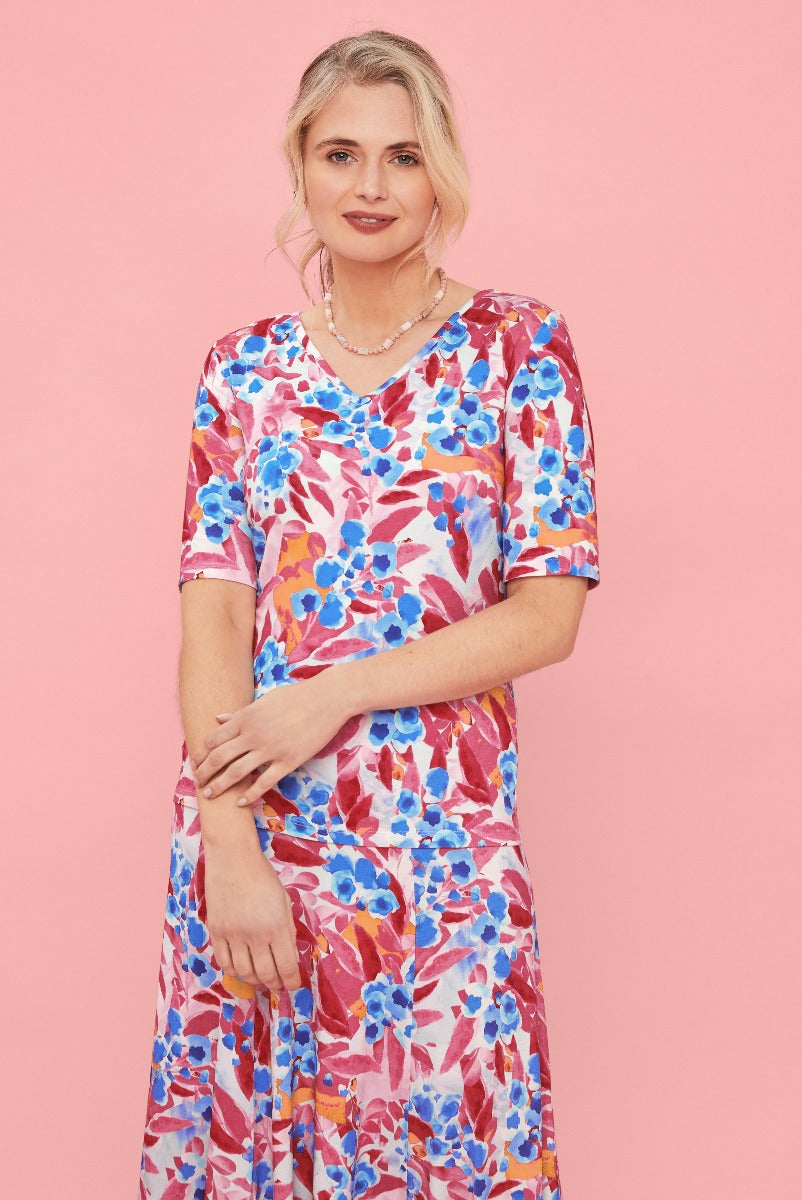 Lily Ella Collection floral print midi dress in pink and blue, stylish women's spring summer fashion, elegant casual dress with necklace accessory.