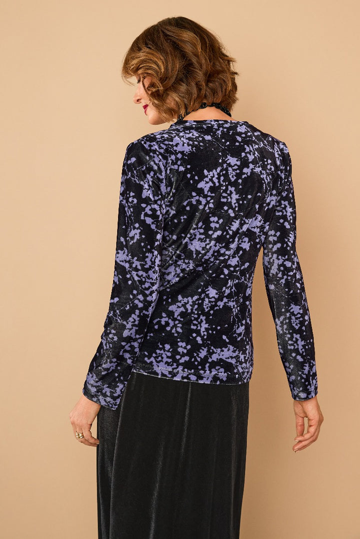 Lily Ella Collection navy blue floral velvet top rear view on model with elegant hairstyle, premium women's fashion and style.