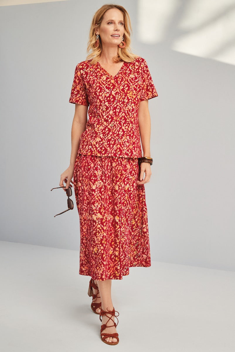 Lily Ella Collection red patterned midi dress, elegant floral print, V-neck summer dress with short sleeves, styled with brown sandals and accessories